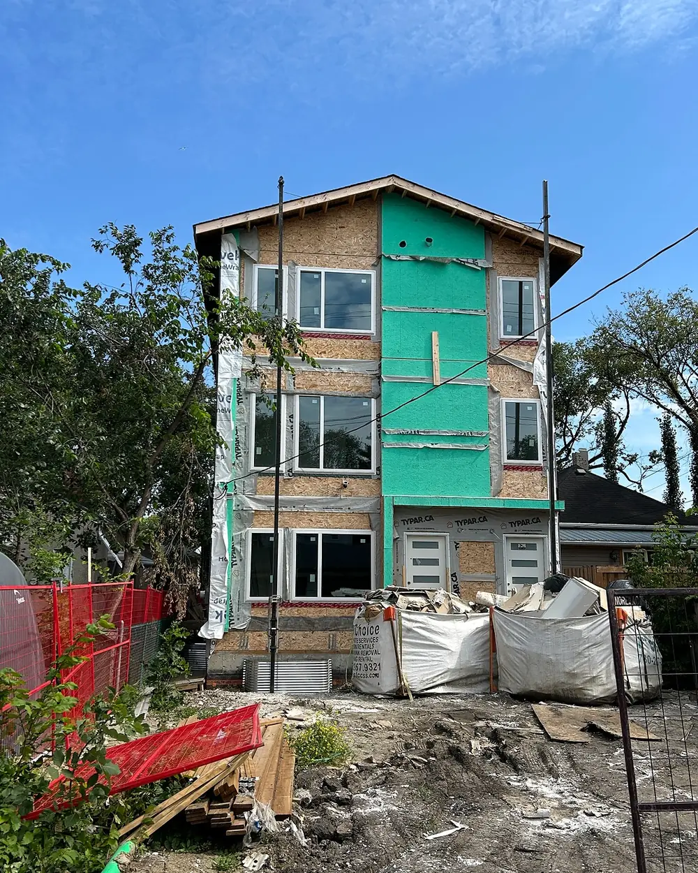 Multifamily infill under construction at the framing and sheathing stage